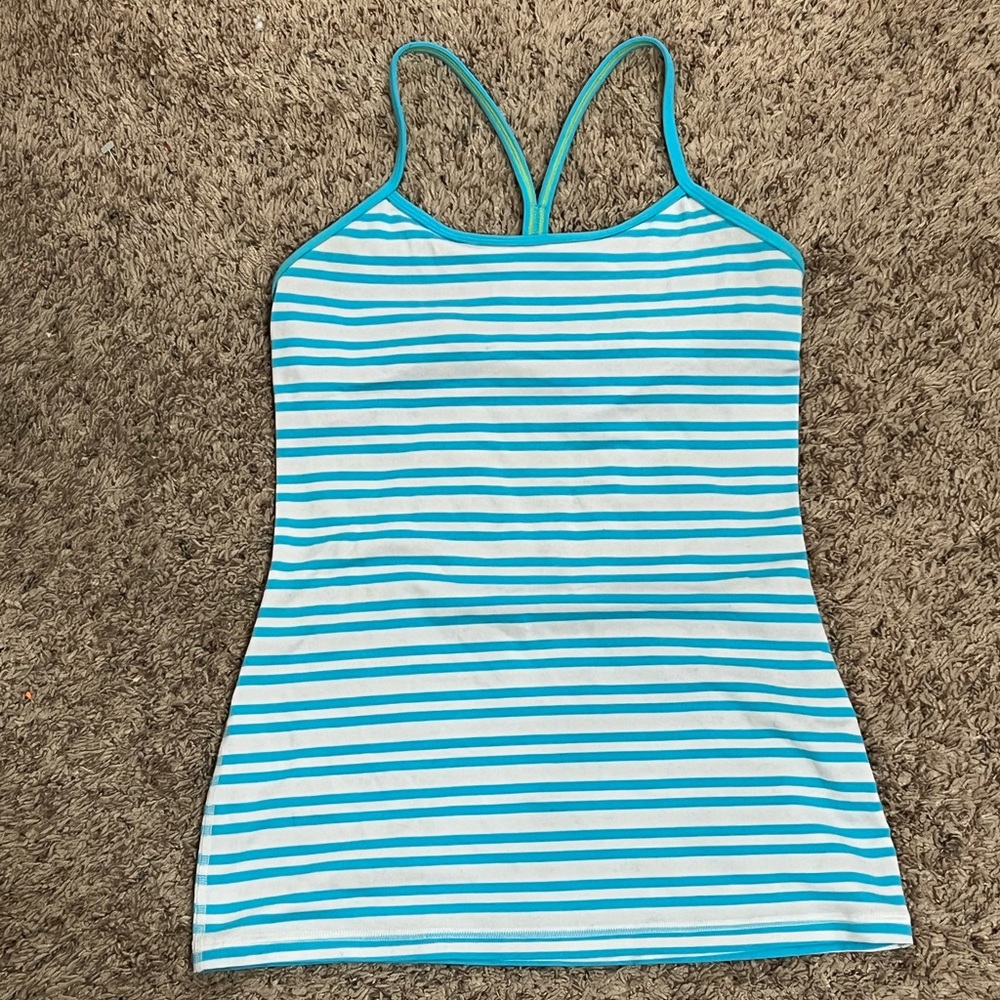 Woman’s lululemon size 4 speed back blue striped tank top with green stitching